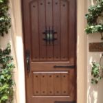 Stained walnut, clavos, speakeasy with grill, hinge straps, Emtek full length handle set