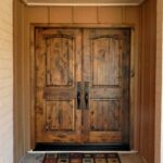 Knotty alder door, Emtek full length rectangular handle set, stained custom finish.