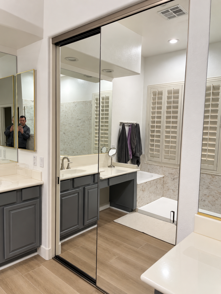 Full-length mirrored bypass closet door with aluminum frame