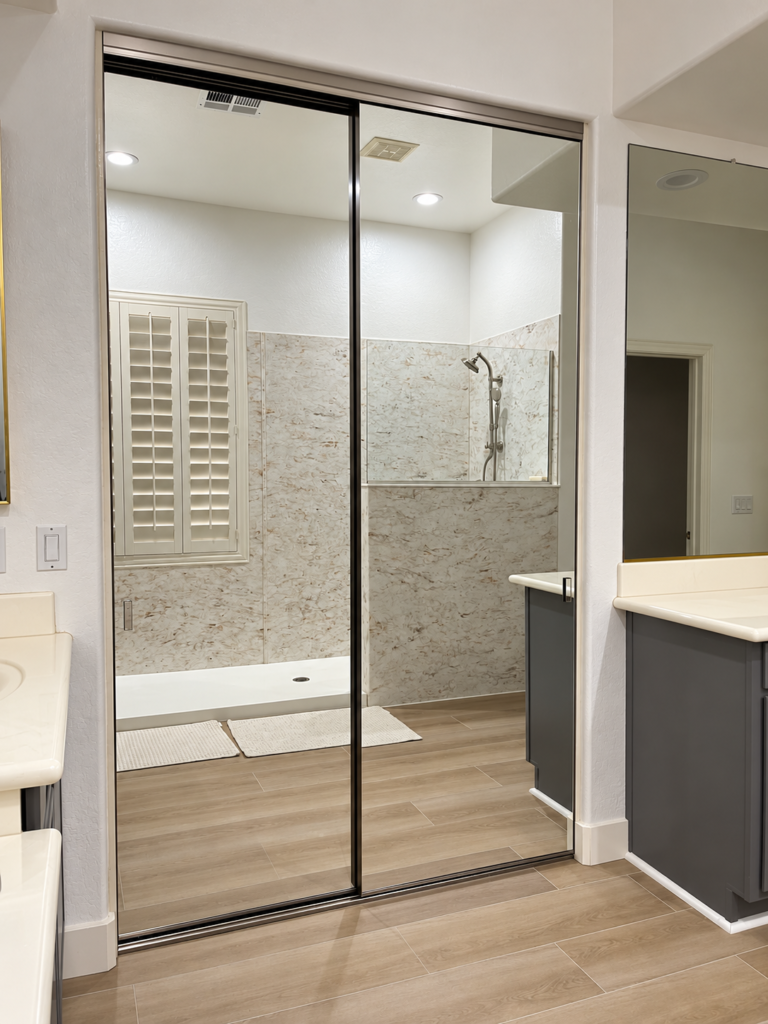 Mirrored bypass sliding closet doors installed in Anthem AZ bathroom