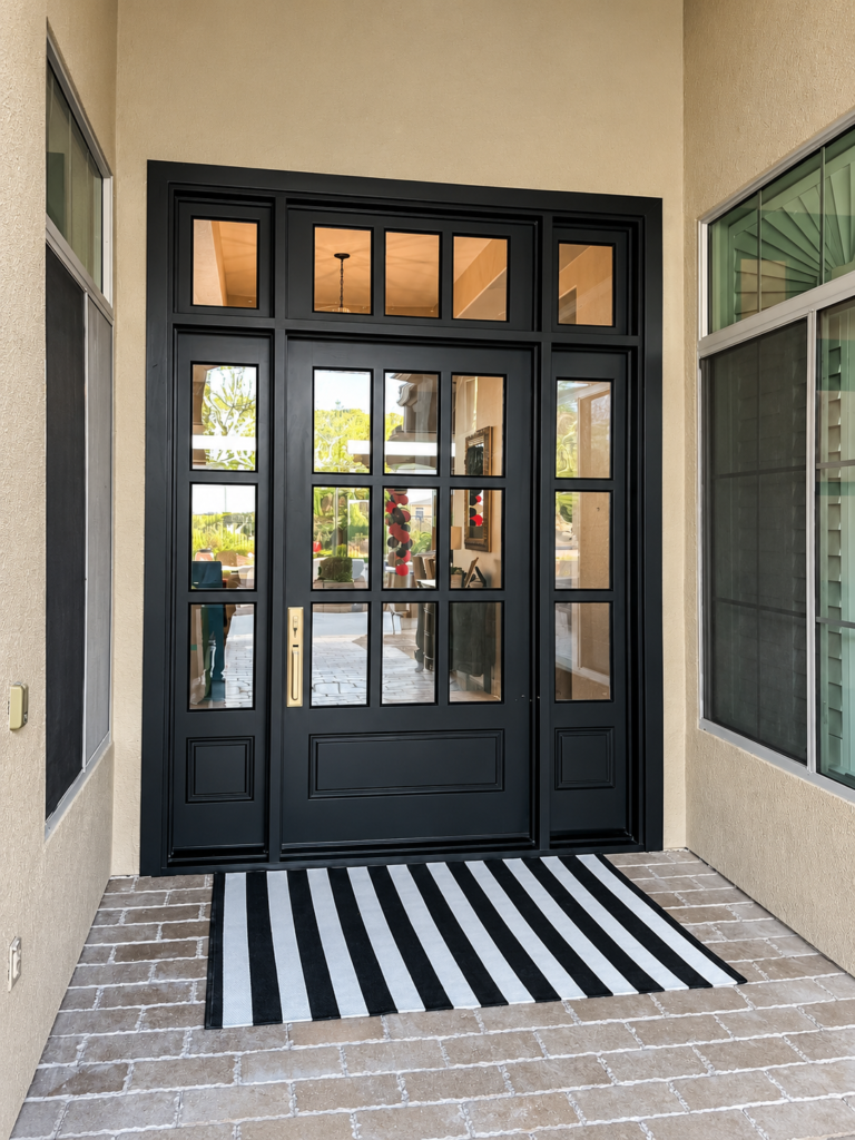 Custom black double front entry door with glass panels