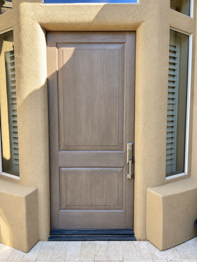 Gray woodgrain fiberglass front entry door installed in Anthem AZ