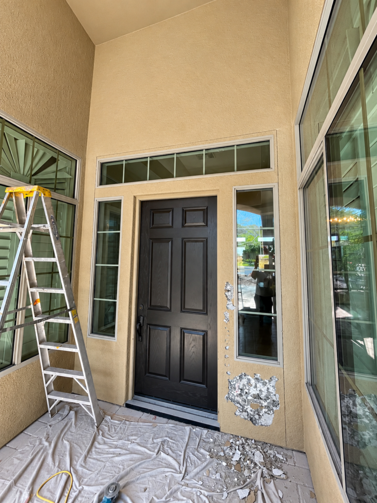 Existing front entry door before replacement in Anthem AZ